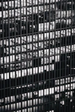 a black and white photo of a bunch of windows