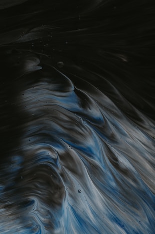 An abstract visualization of probability waves merging with quantum particles in a dark space.