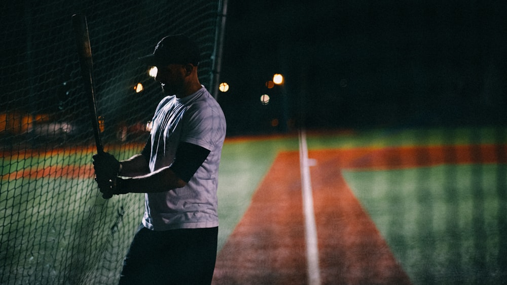 a man holding a tennis racquet on a tennis court