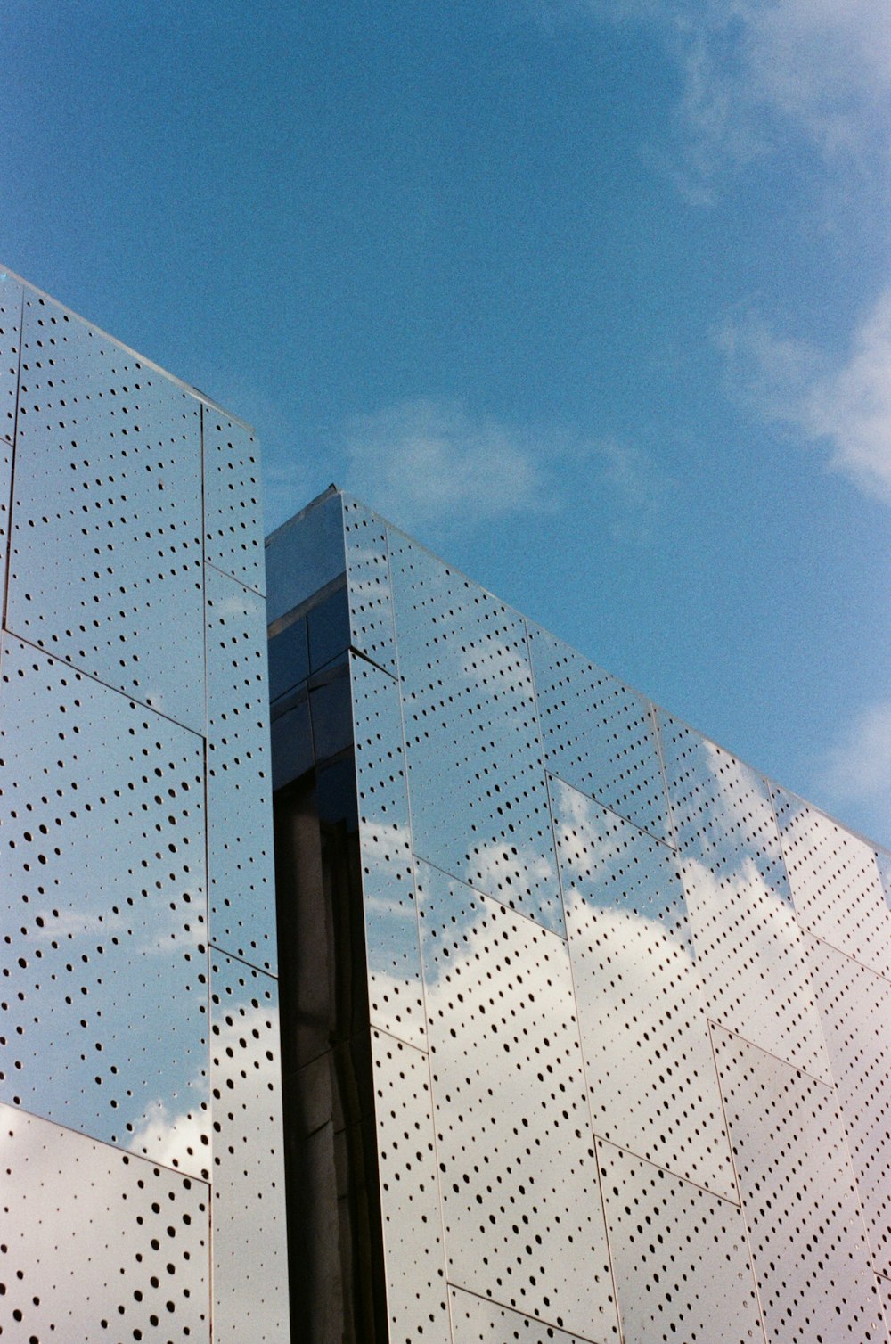 a tall building with a sky in the background