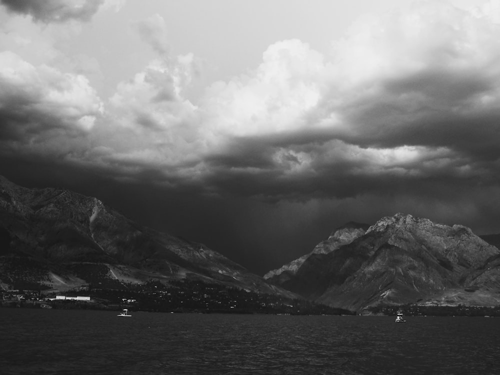 a black and white photo of a mountain range
