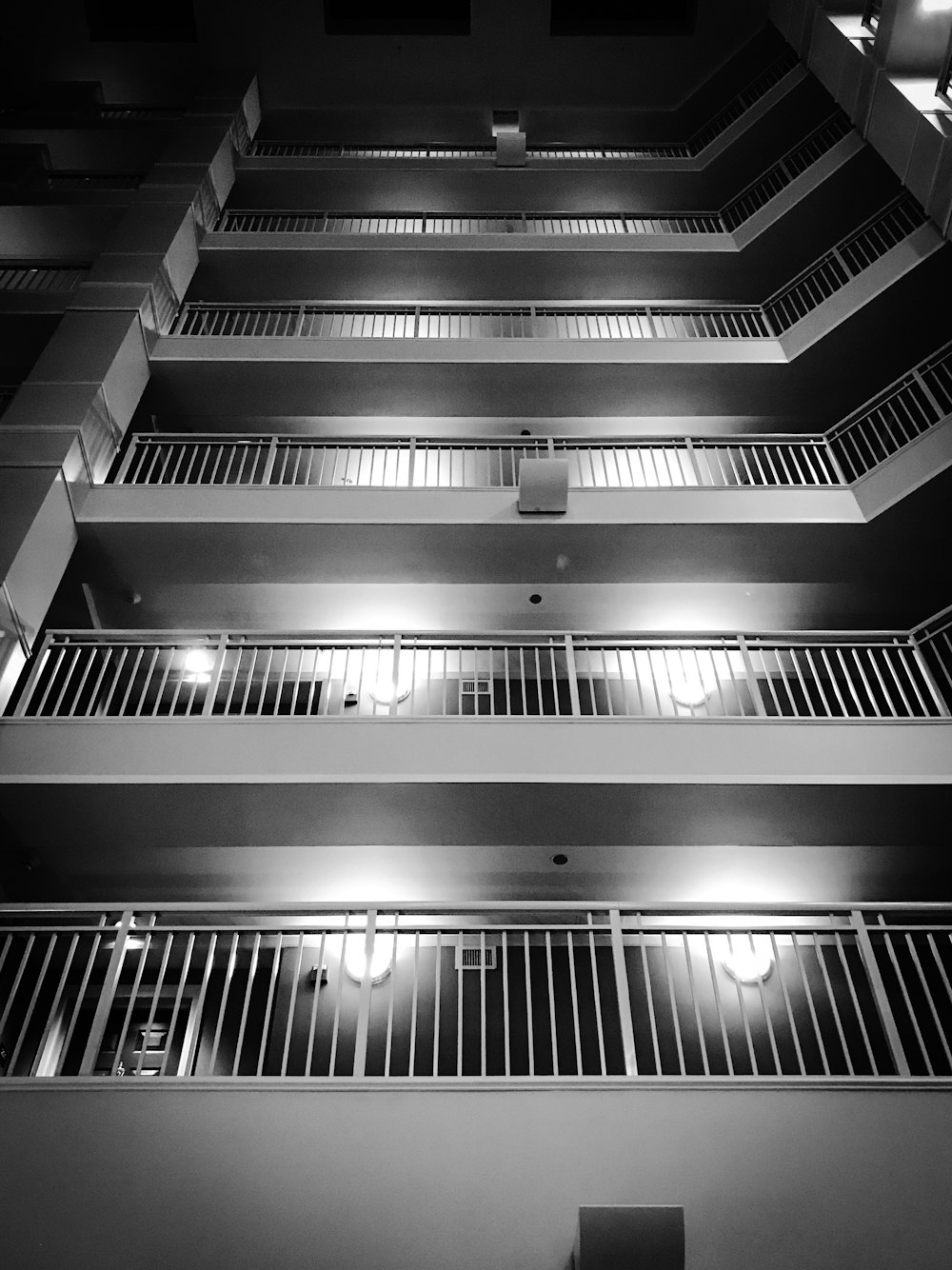 a black and white photo of a building at night