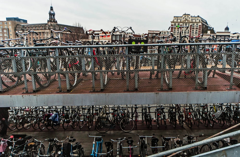 a bunch of bikes are parked in a parking lot