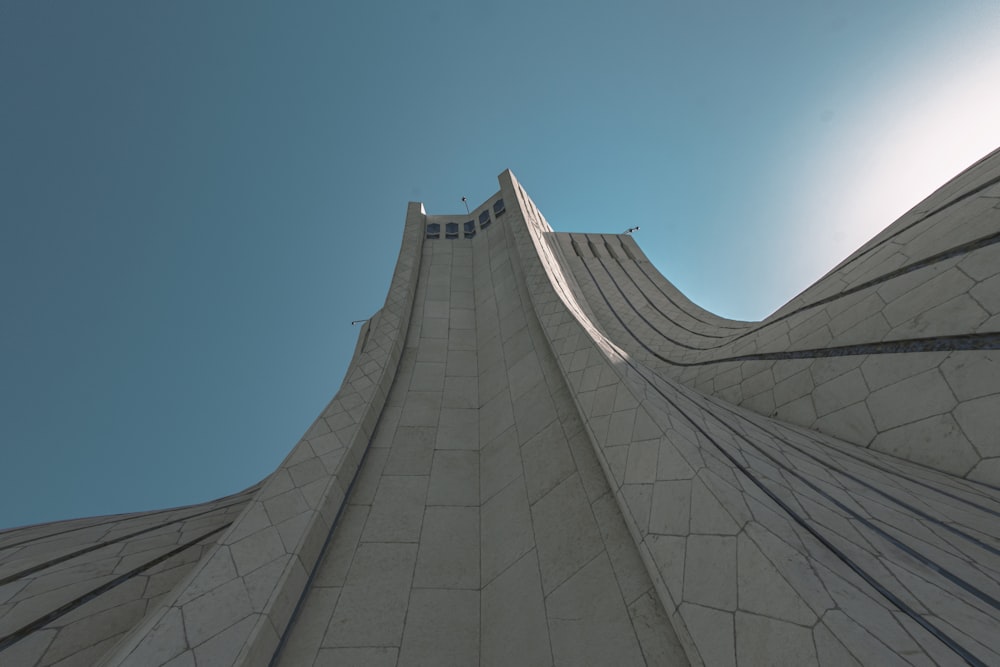 looking up at the top of a tall building