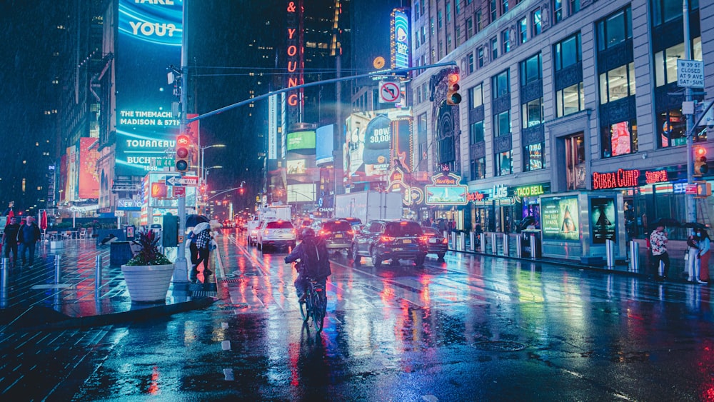 a city street at night with a lot of traffic