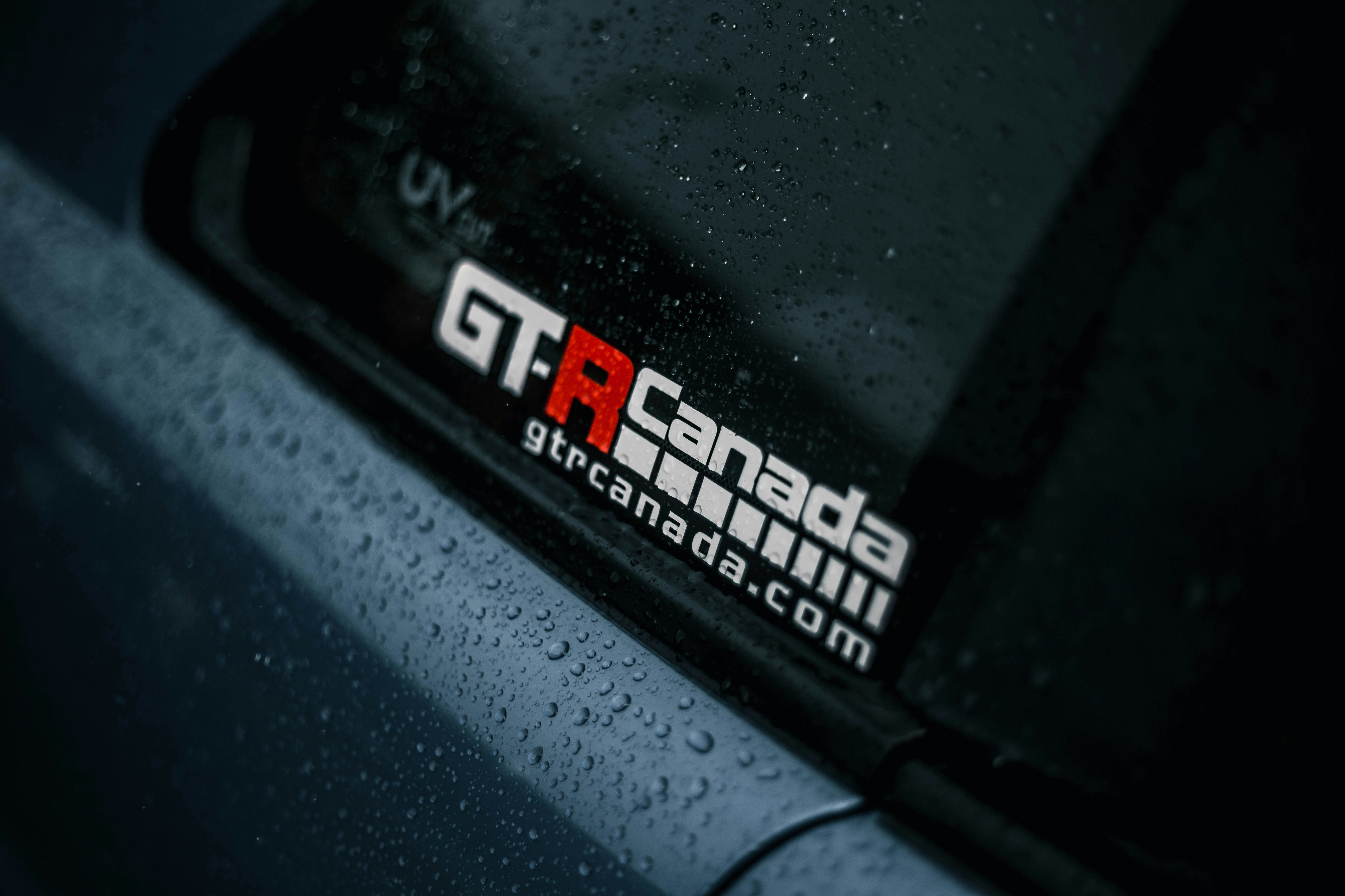 a close up of a car with rain drops on it