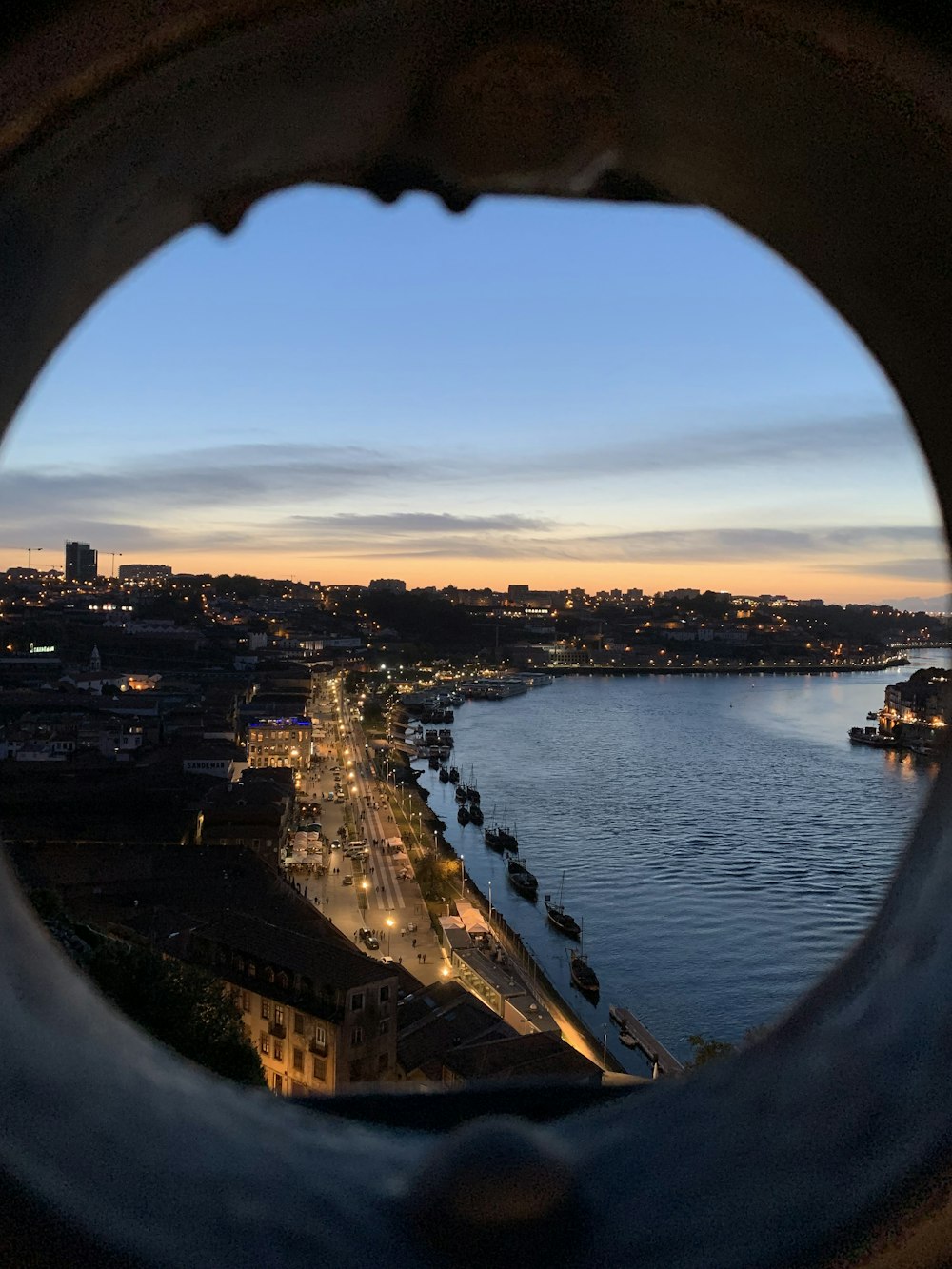 a view of a city from a porthole