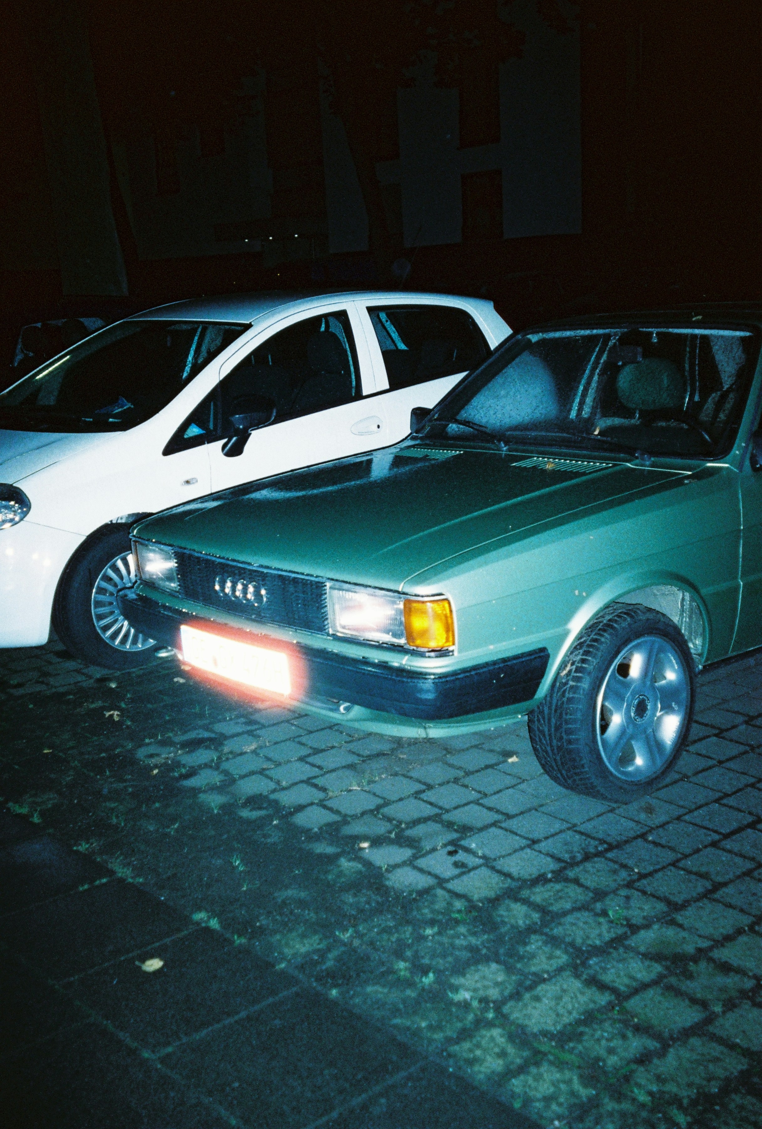 a couple of cars parked next to each other