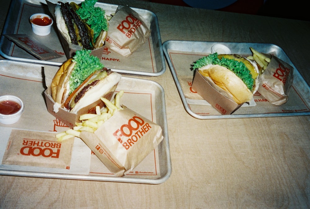 two trays of food on a table