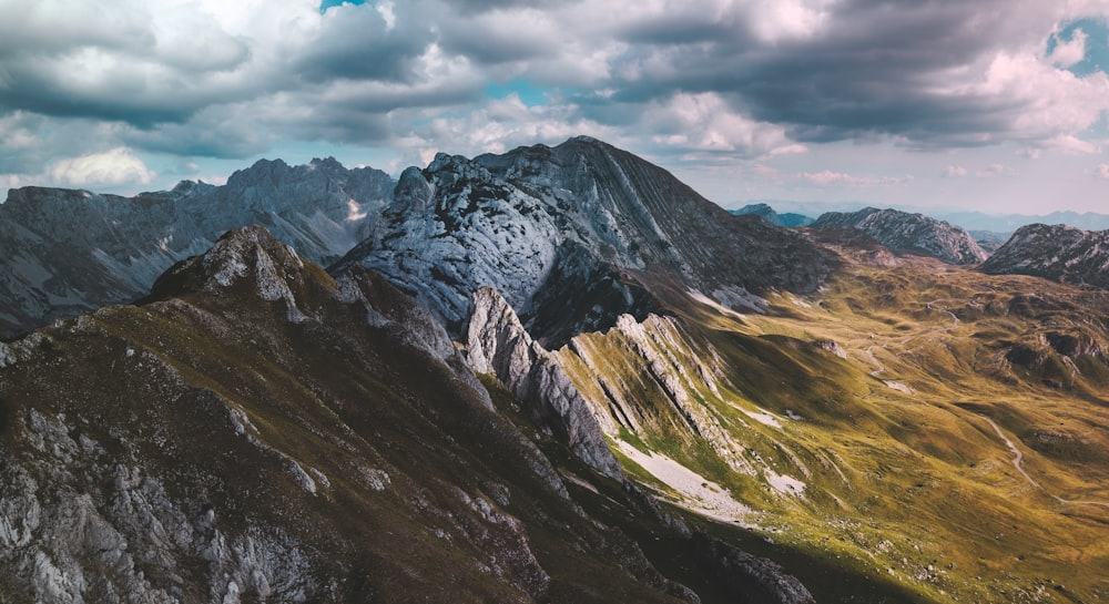 a view of a mountain range with a cloudy sky