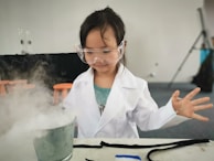 A teacher guiding students in a science experiment.