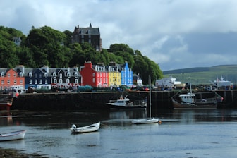 a group of boats floating on top of a body of water