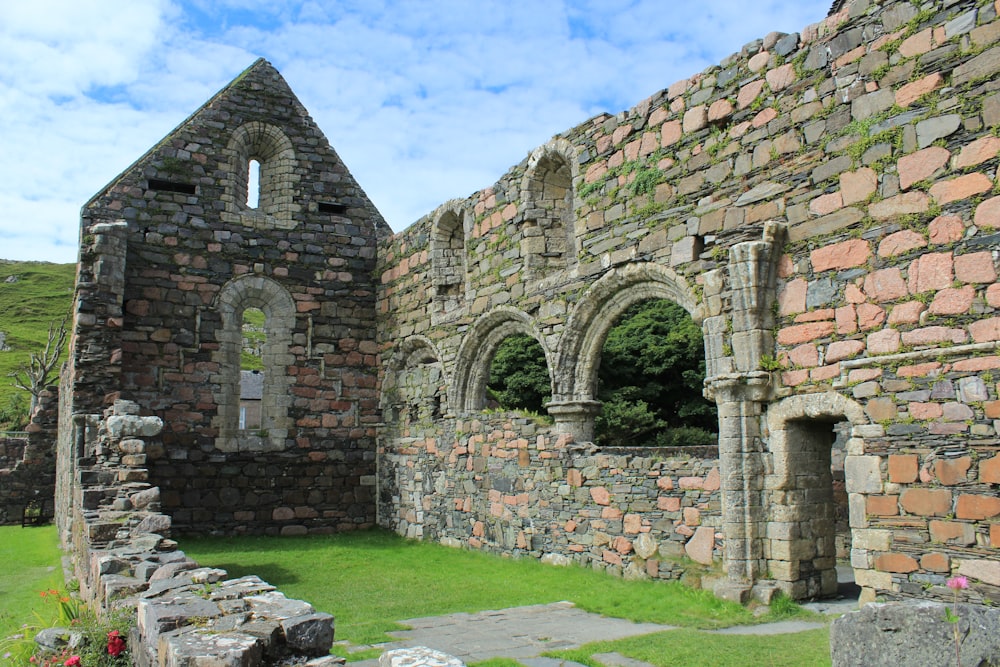 an old stone building with a stone walkway leading to it