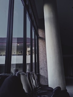 a row of chairs sitting in front of a window