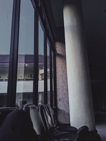 a row of chairs sitting in front of a window