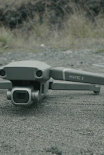 DJI Matrice 300 RTK drone equipped with Zenmuse L1 LiDAR scanning a landscape.