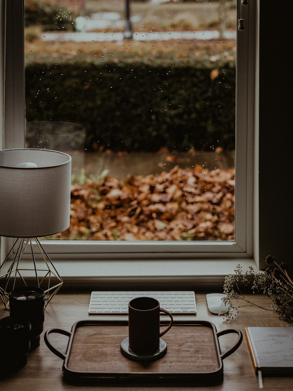 a computer sitting on top of a window