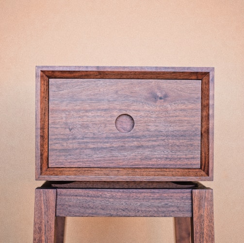 a wooden table with a drawer on top of it