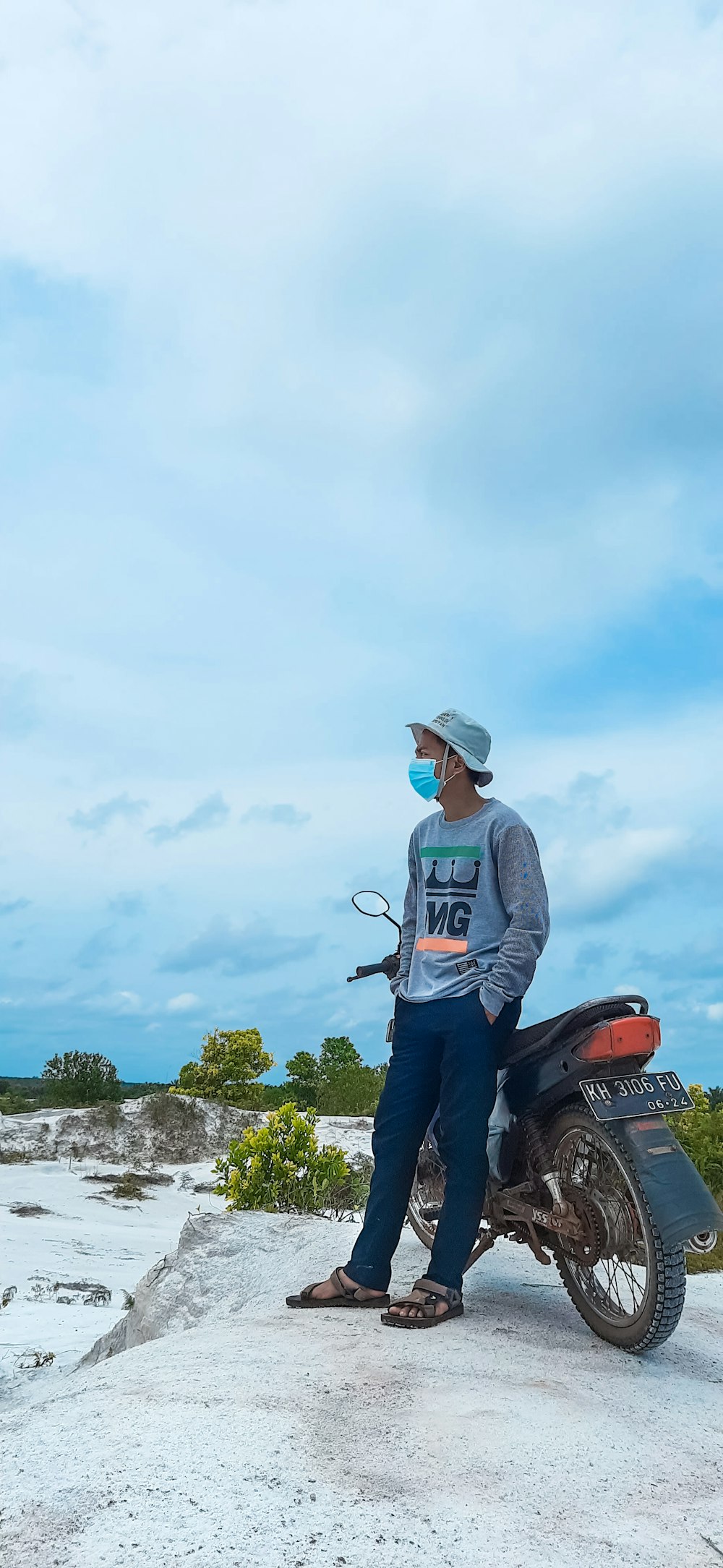 a man sitting on top of a motorcycle