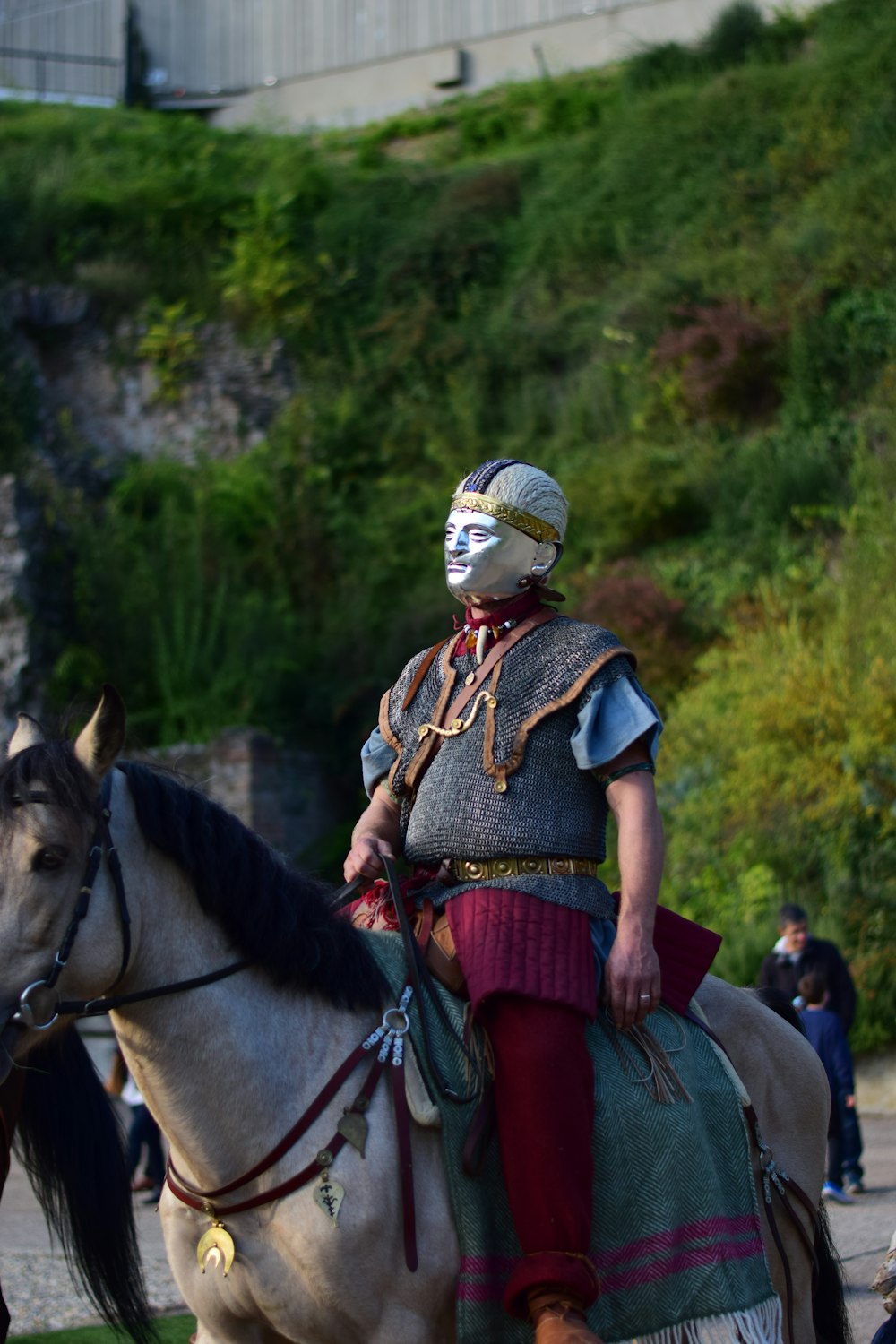 a man in a costume riding a horse