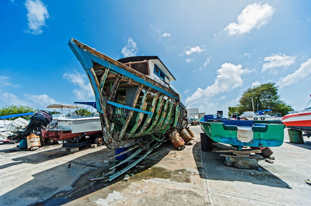 a couple of boats that are sitting on the ground