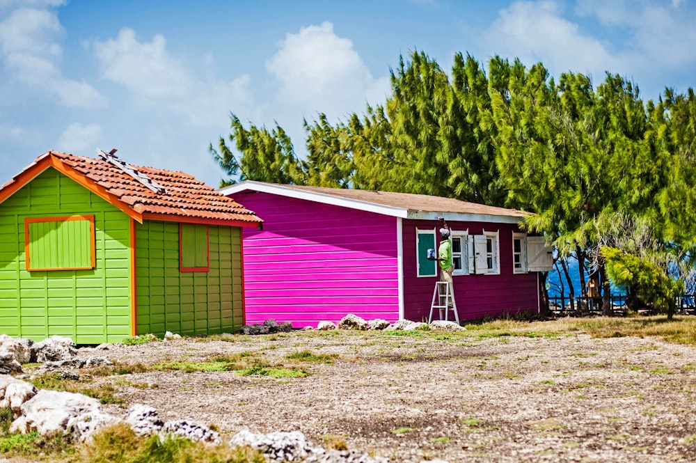 a row of colorful houses sitting next to each other