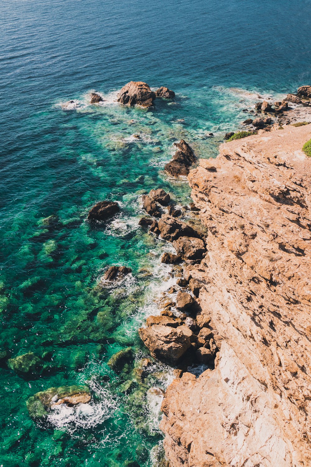 a view of the ocean from the top of a cliff