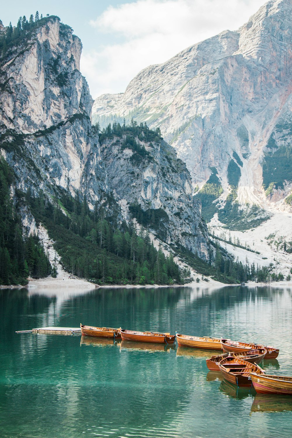 a group of canoes floating on top of a lake