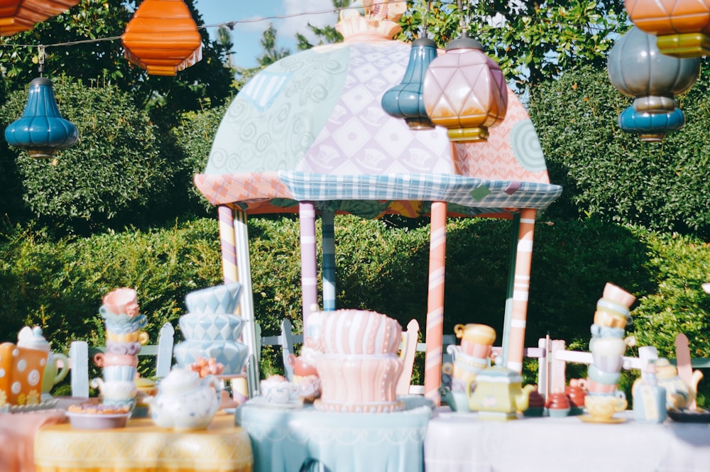 a table covered in lots of different colored items