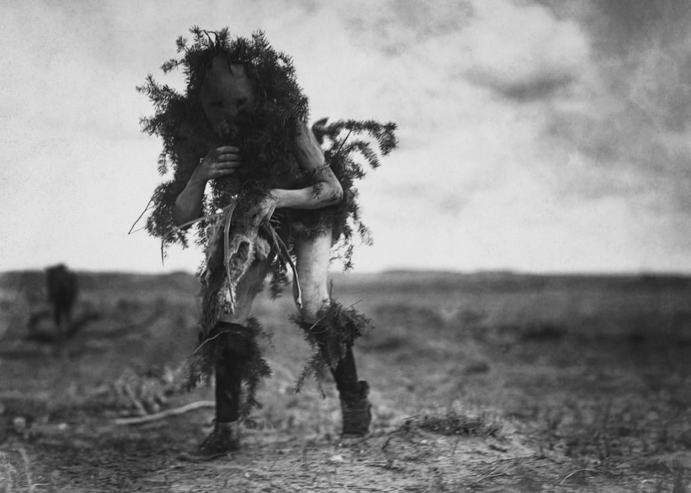 a man standing in the middle of a field