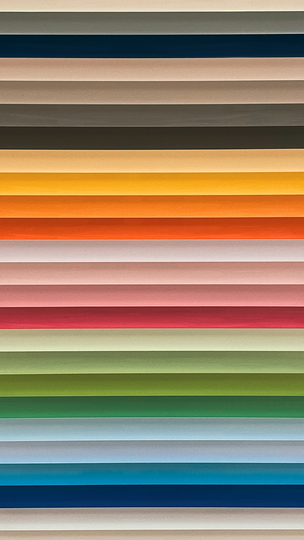 a group of different colored lines on a wall