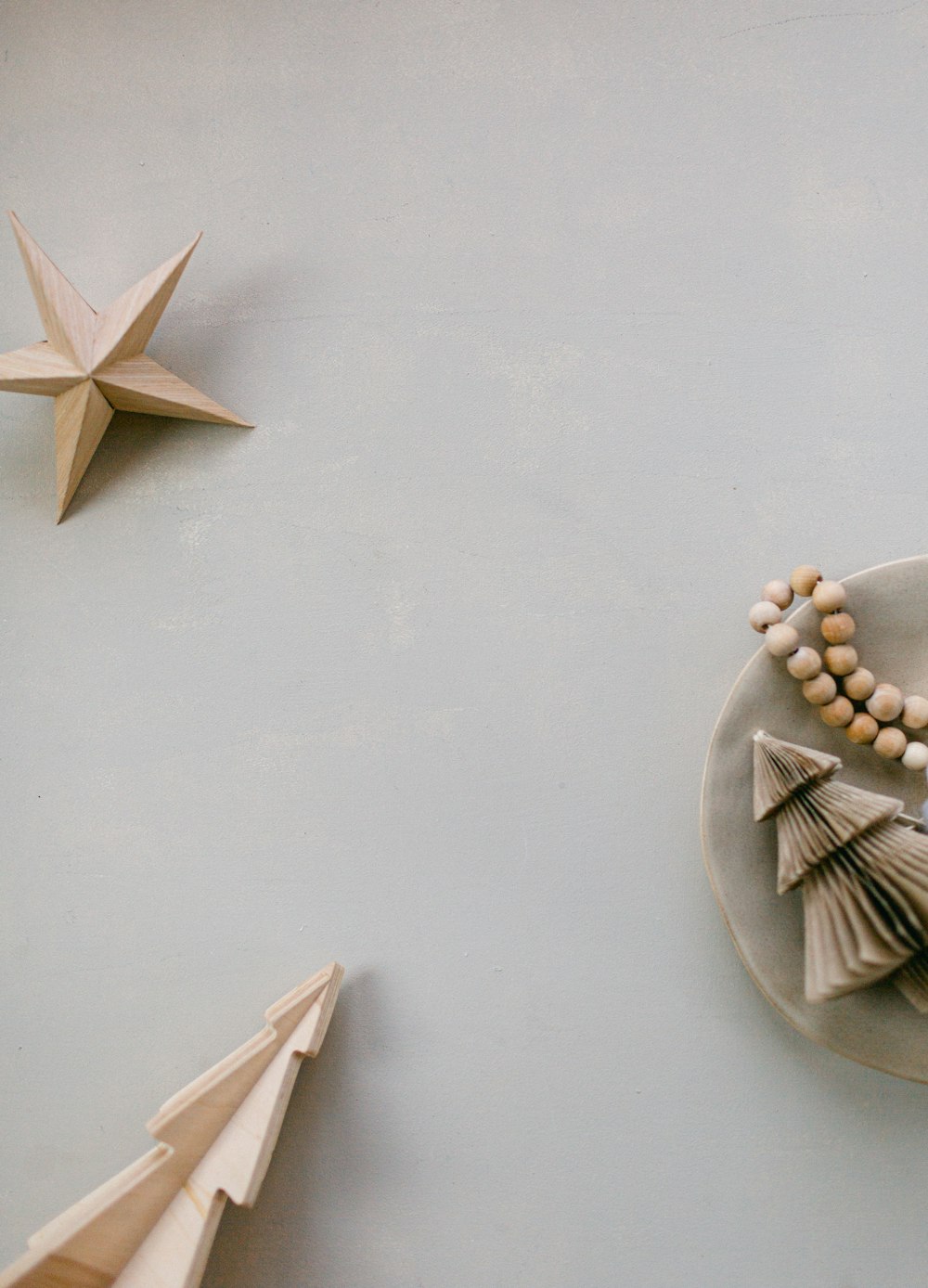 a white plate topped with a wooden beaded necklace