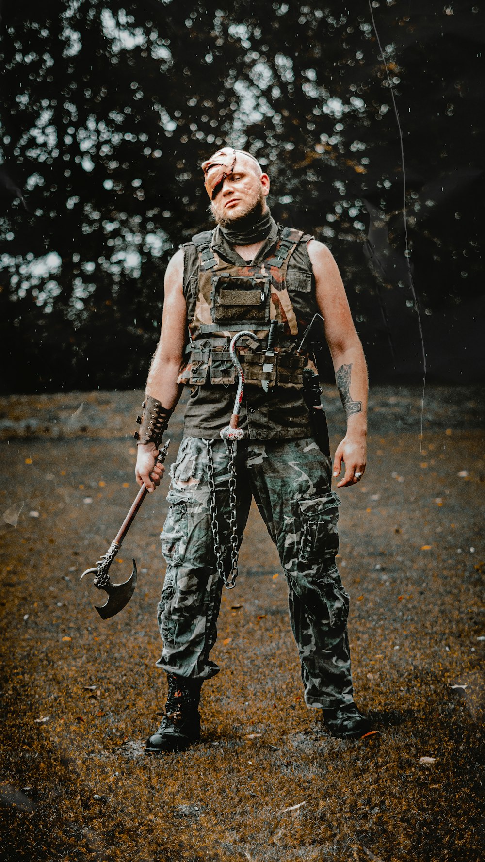 a man in a camouflage outfit holding a wrench