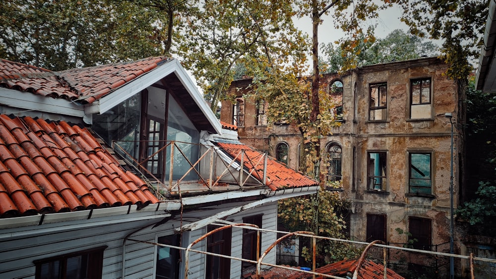 an old building with a red tiled roof