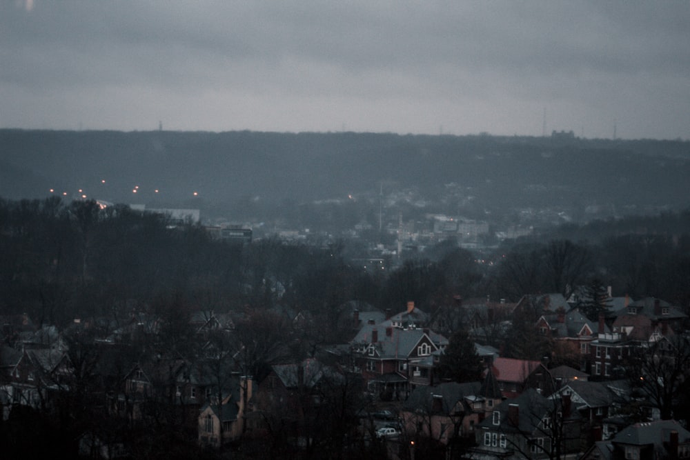 a view of a city from a hill at night