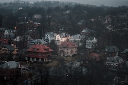 Cozy neighborhood street with rounded UI style overlays in soft grey and cream.