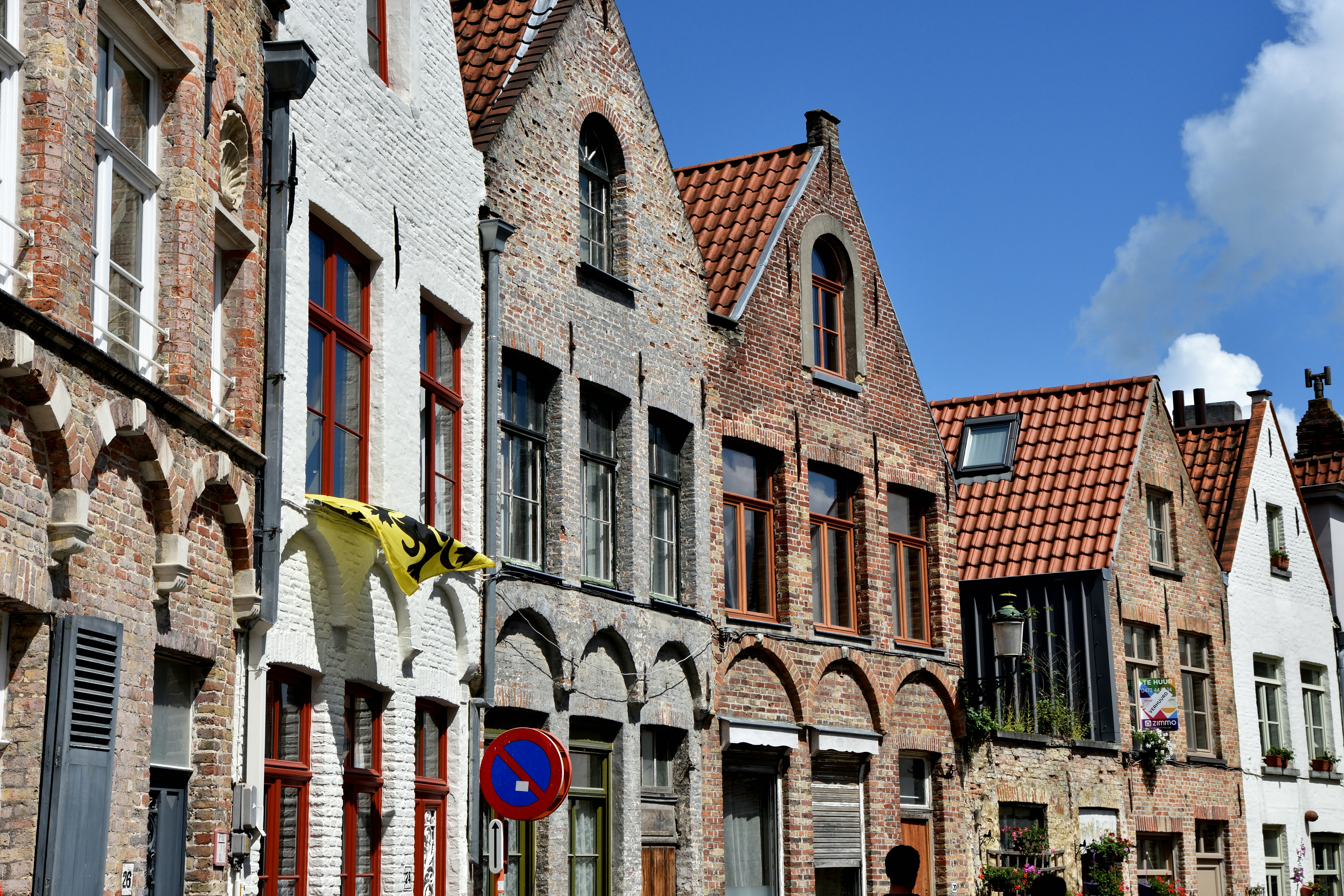 a row of old brick buildings on a street