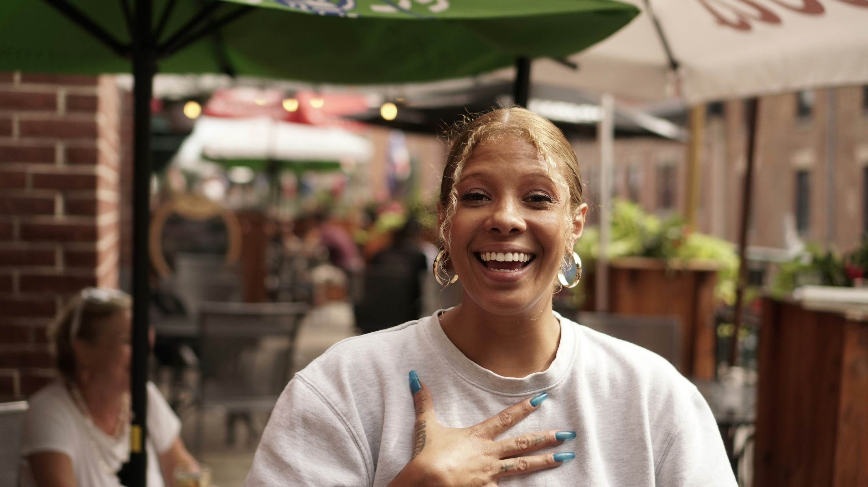 a woman with a peace sign in her hand