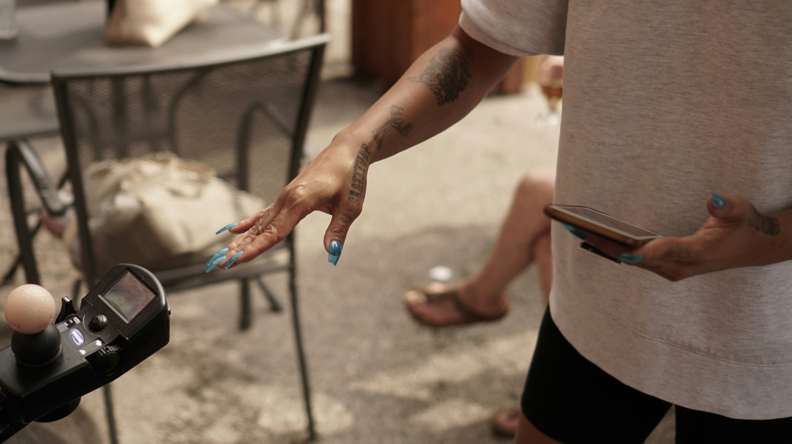 a person holding a cell phone in their hand