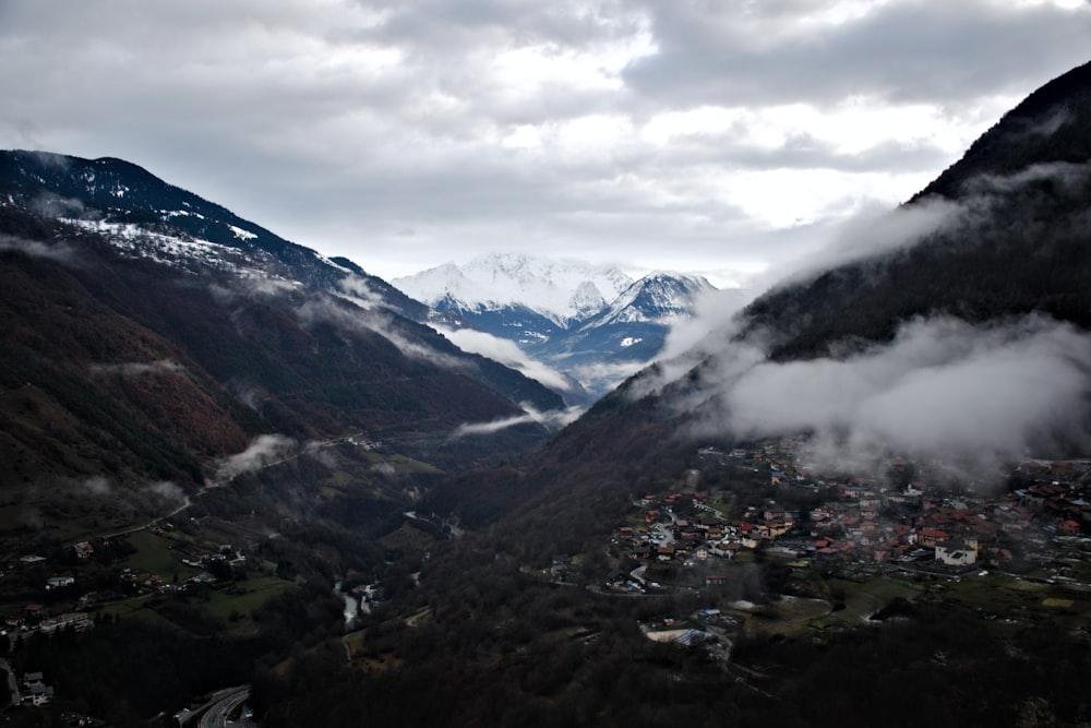 a view of a valley with mountains in the background