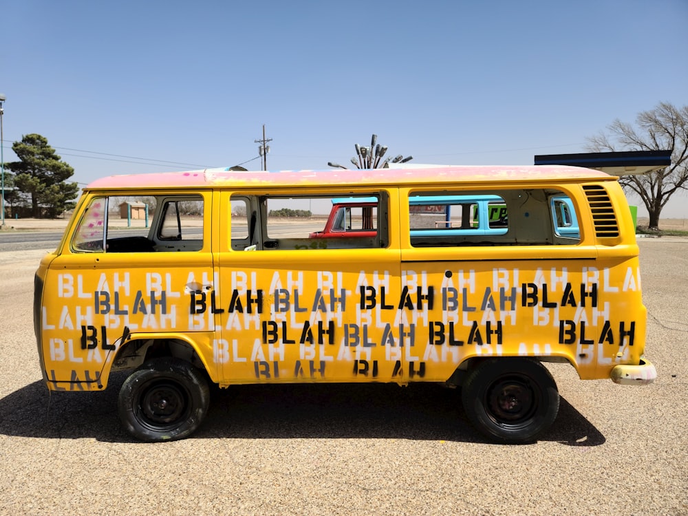 a yellow and white van parked in a parking lot