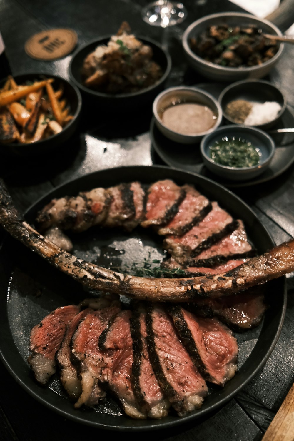 a plate of steak and fries on a table