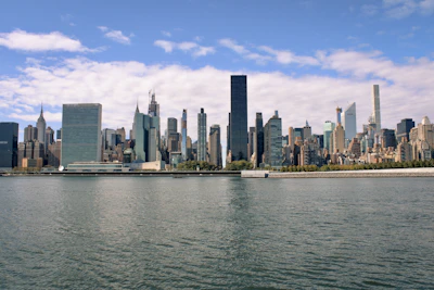 a large body of water with a city in the background