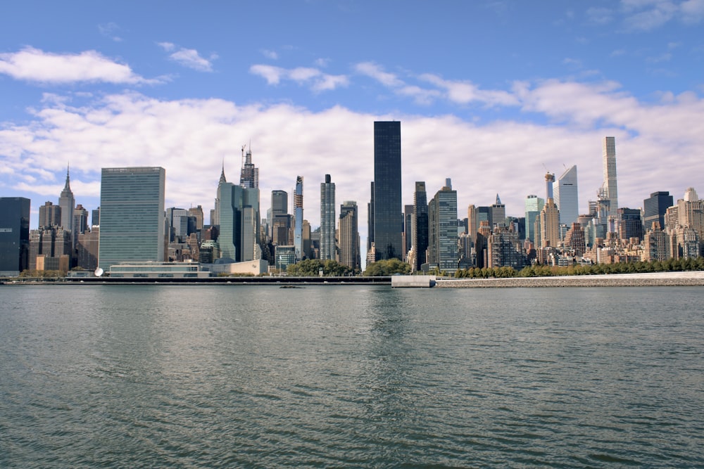 a large body of water with a city in the background