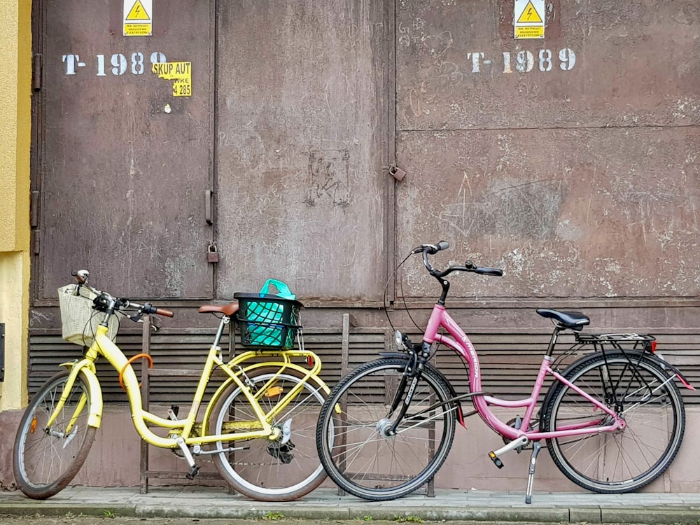 two bikes parked next to each other in front of a building