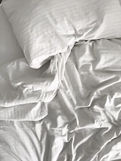Artistic shot of a mattress corner with soft shadows emphasizing its clean lines and craftsmanship