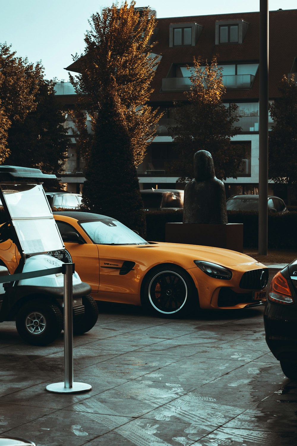 a group of cars parked next to each other in a parking lot