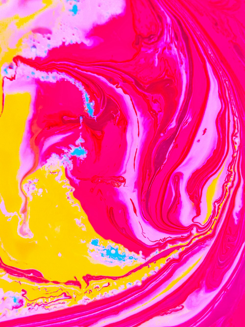 a close up of a colorful liquid substance