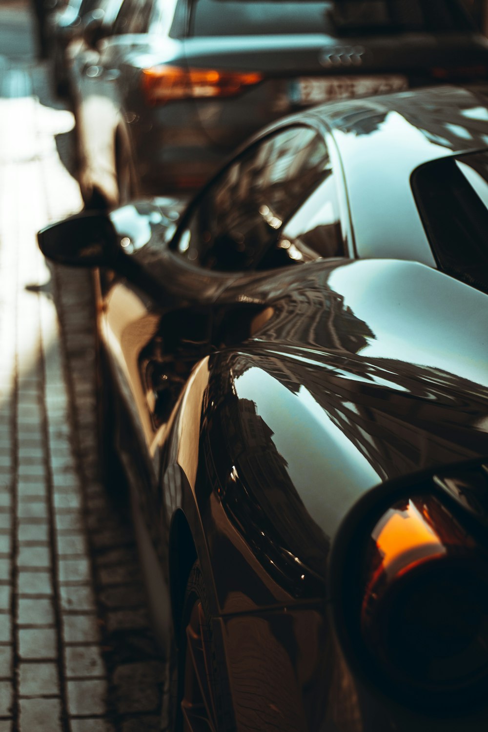 a row of parked cars on a city street