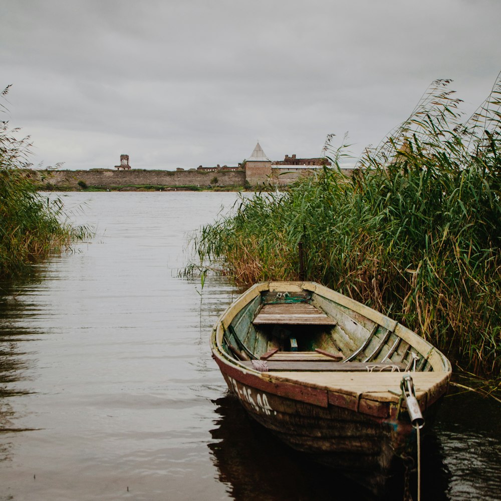 a small boat floating on top of a body of water